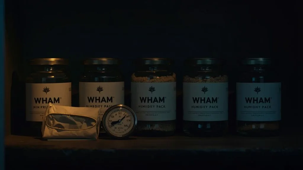 Sealed NexaDistro glass jars stored on a cool dark shelf with a humidity pack and hygrometer